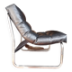 Tubular fireside chair in black skai and metal, design 1970