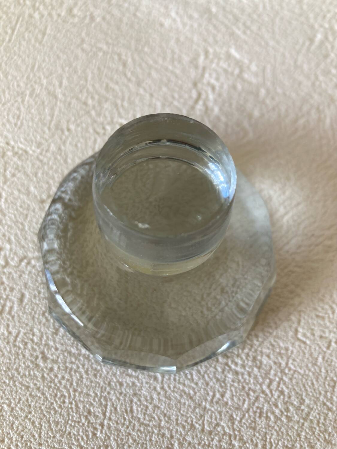 Small carafe in blown cut glass with engraved decoration of vine leaves and grapes, threaded stopper