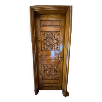 Interior door in carved and framed solid wood