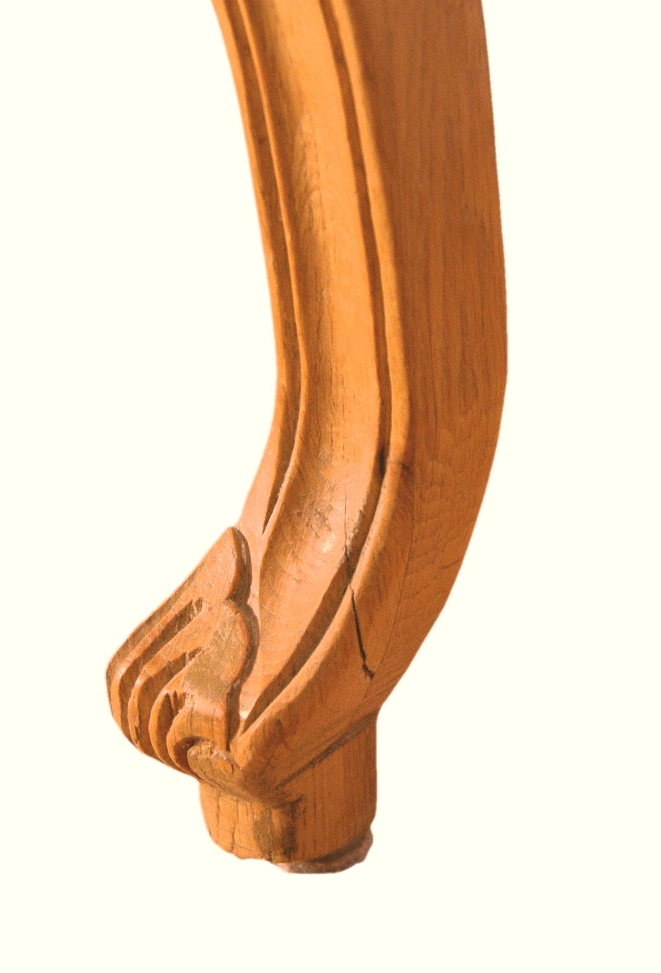 Armchair in solid oak with caning and a central leg (known as couillard), 89x68cm.