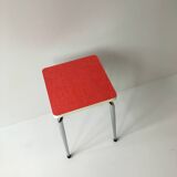 Stool in pinkish red formica