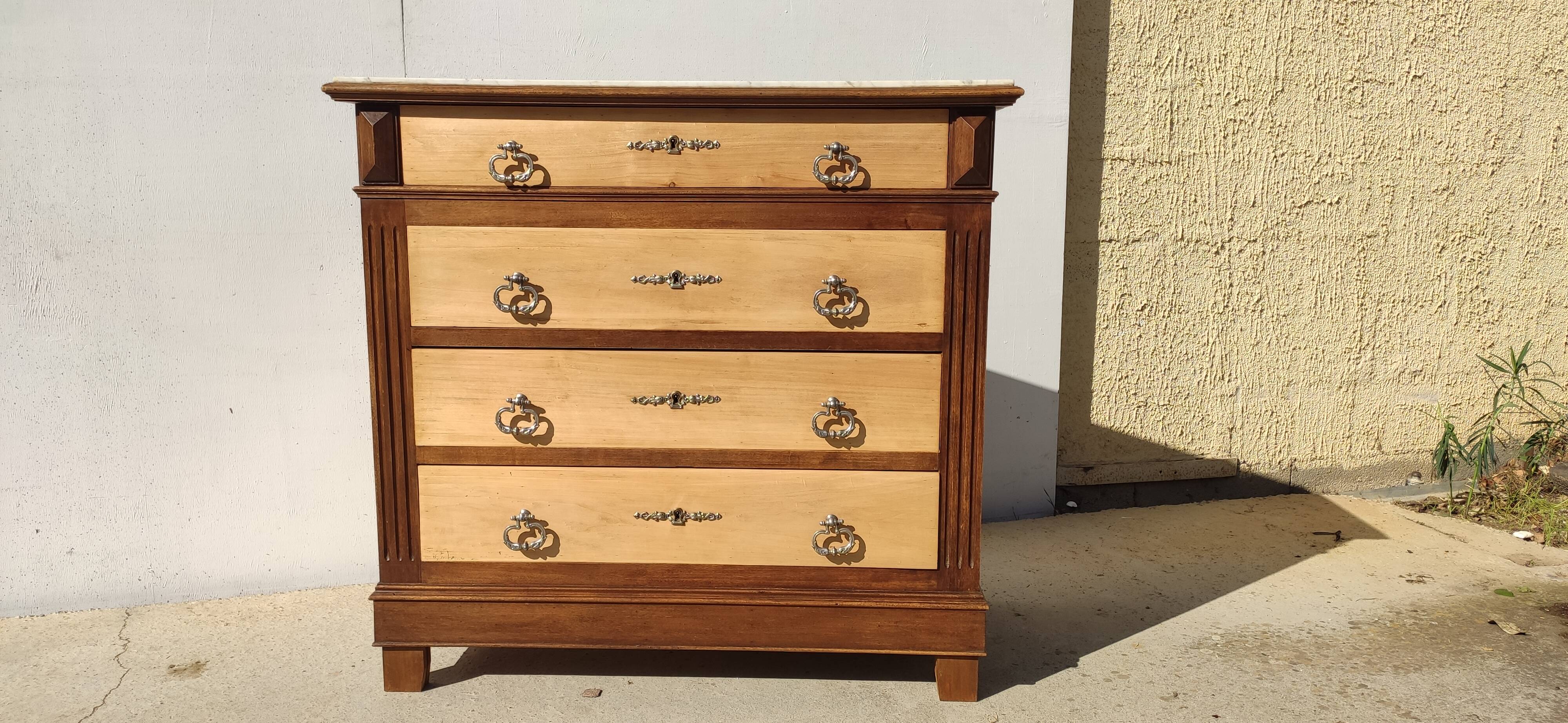 Antique chest of drawers, white marble top.