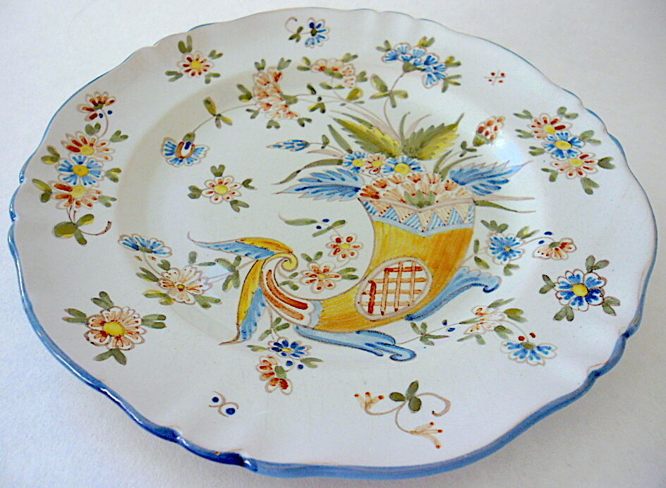 A plate of earthenware decorated with a cornucopia in St. Clement's earthenware