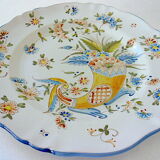 A plate of earthenware decorated with a cornucopia in St. Clement's earthenware