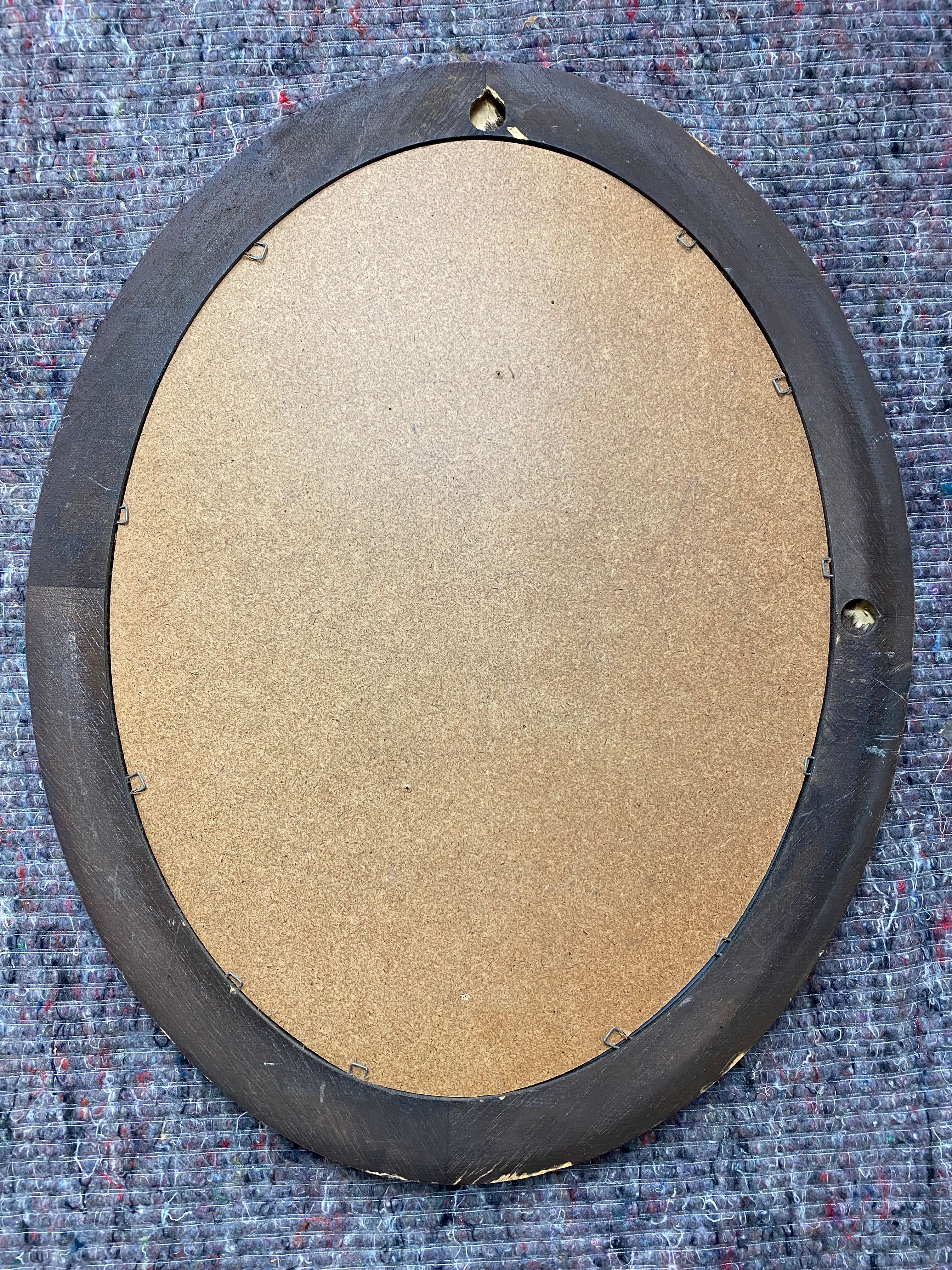 Oval wooden mirror