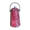 Red and white speckled milk jar in enamel