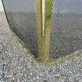 Fireplace screen with 2 panels in gilded brass and expanded metal, 1970s.