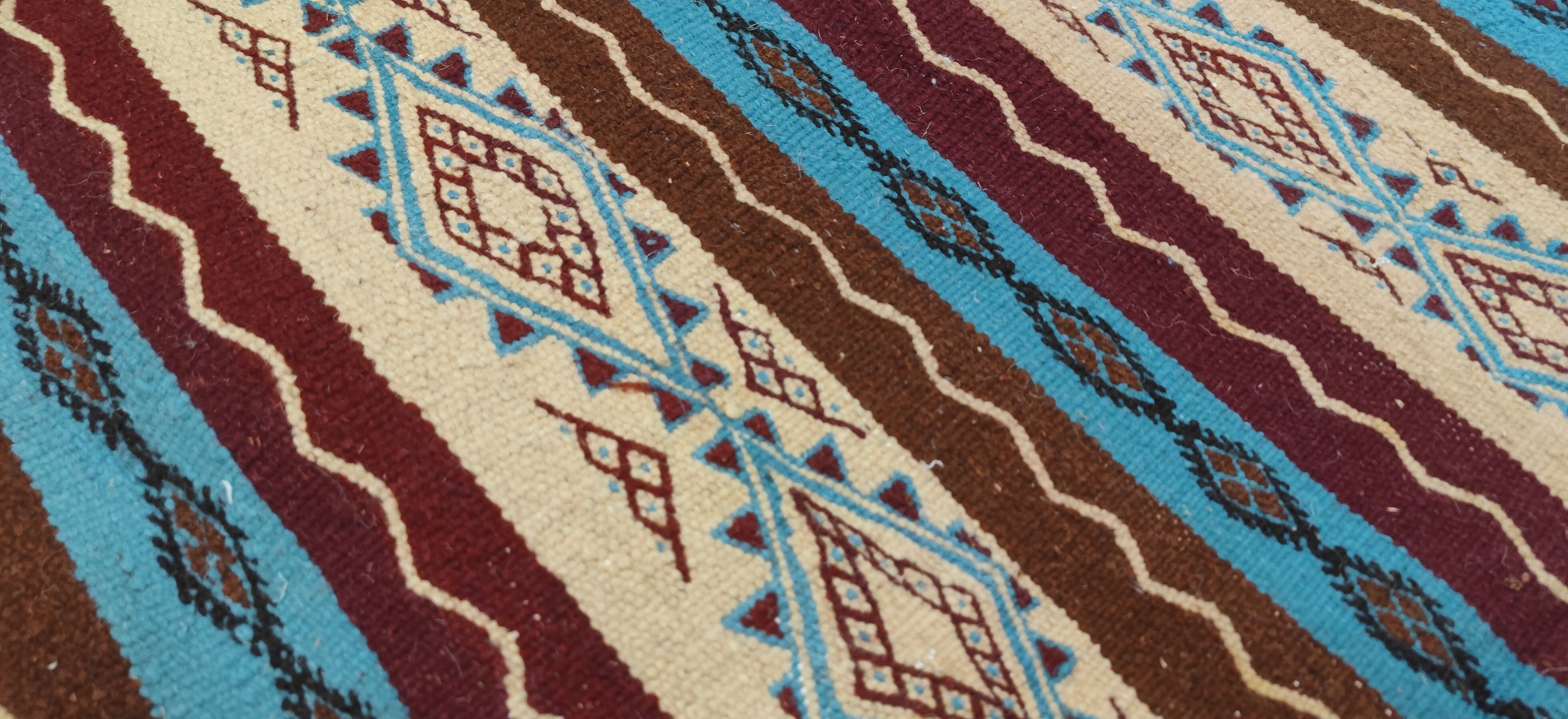 Multicolored hand-woven Berber rugs in natural wool