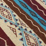 Multicolored hand-woven Berber rugs in natural wool