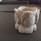 Candlestick in carved stone, signed