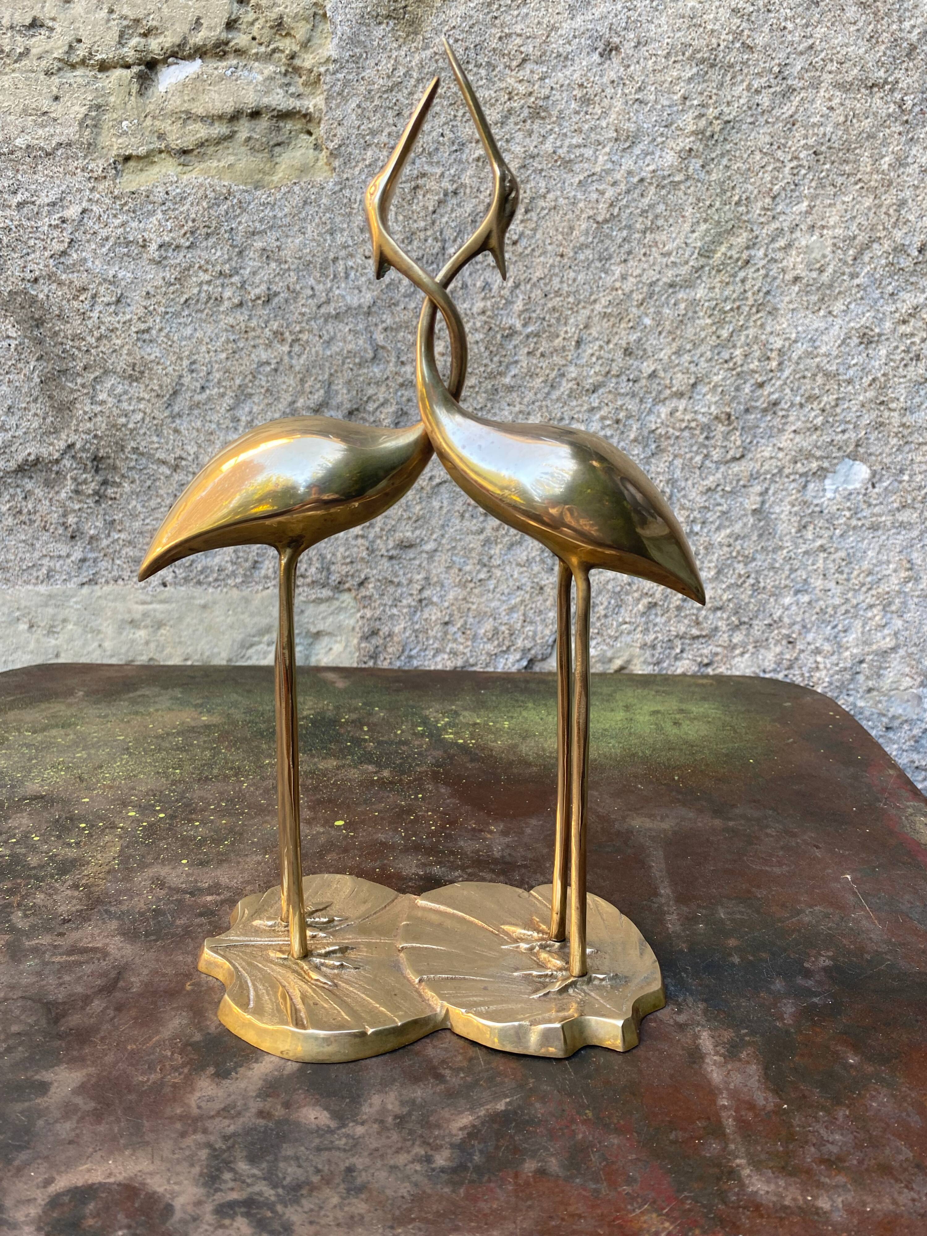 Couple of brass herons