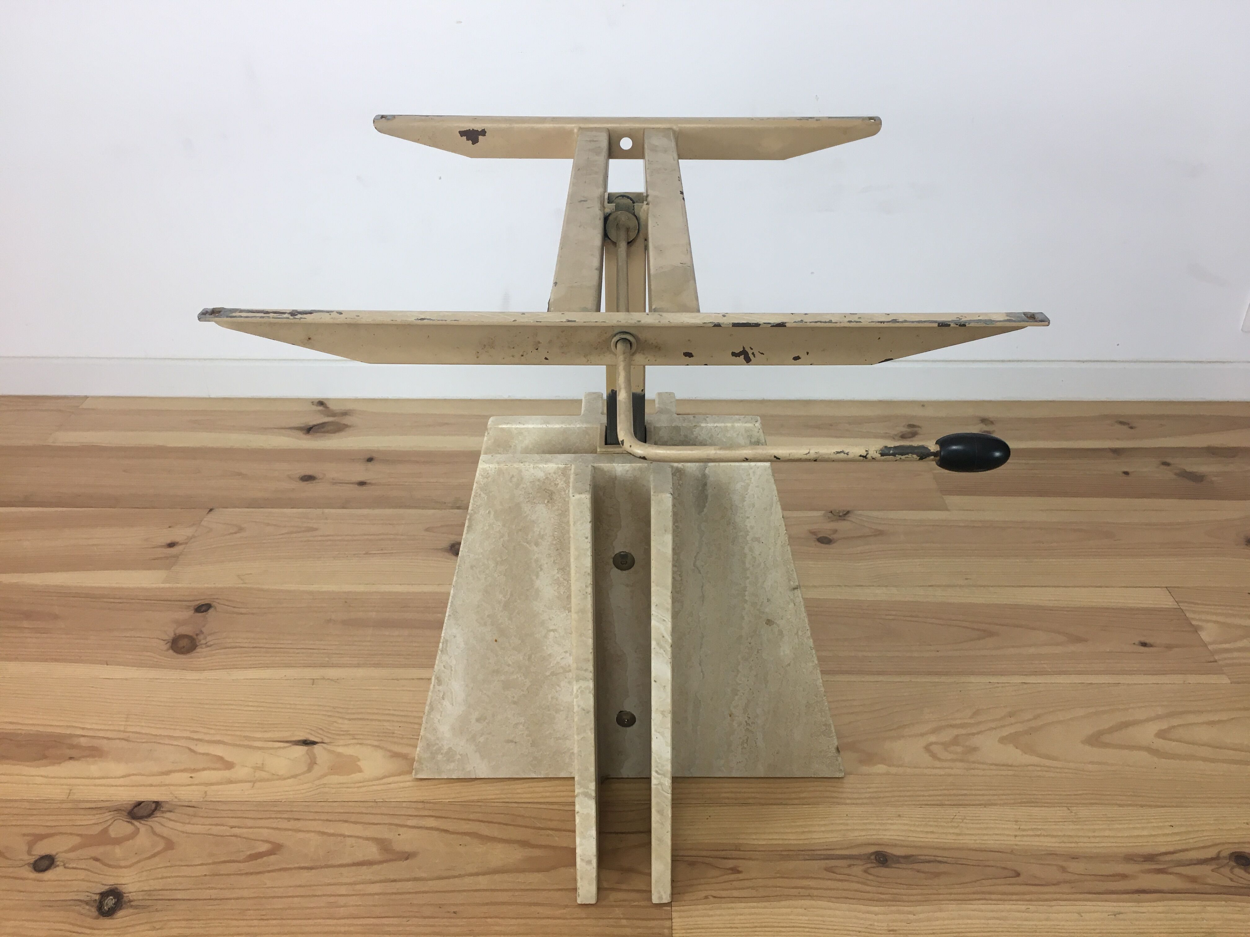 Travertine coffee table goes up and down to jack