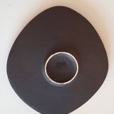 Decorative wall plate with sunflowers.