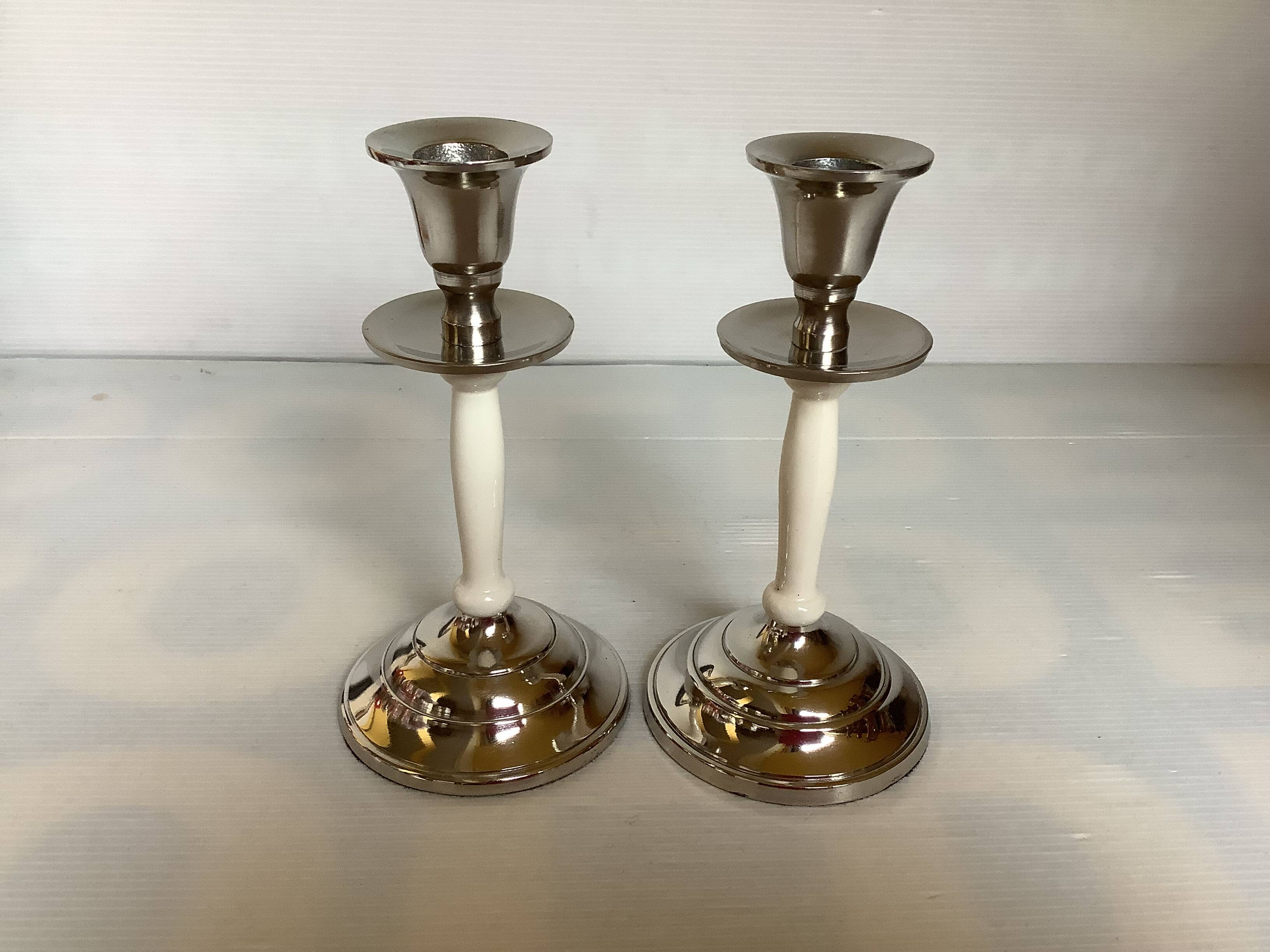 Pair of silver metal candlesticks