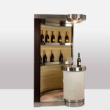 Circular bar in brushed metal, wood and carpet. 1970s.