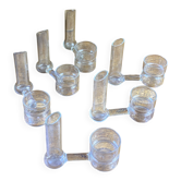 Knife rests, flower vases and candle holders in blown glass.