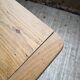 Oak farmhouse table with turned black legs.
