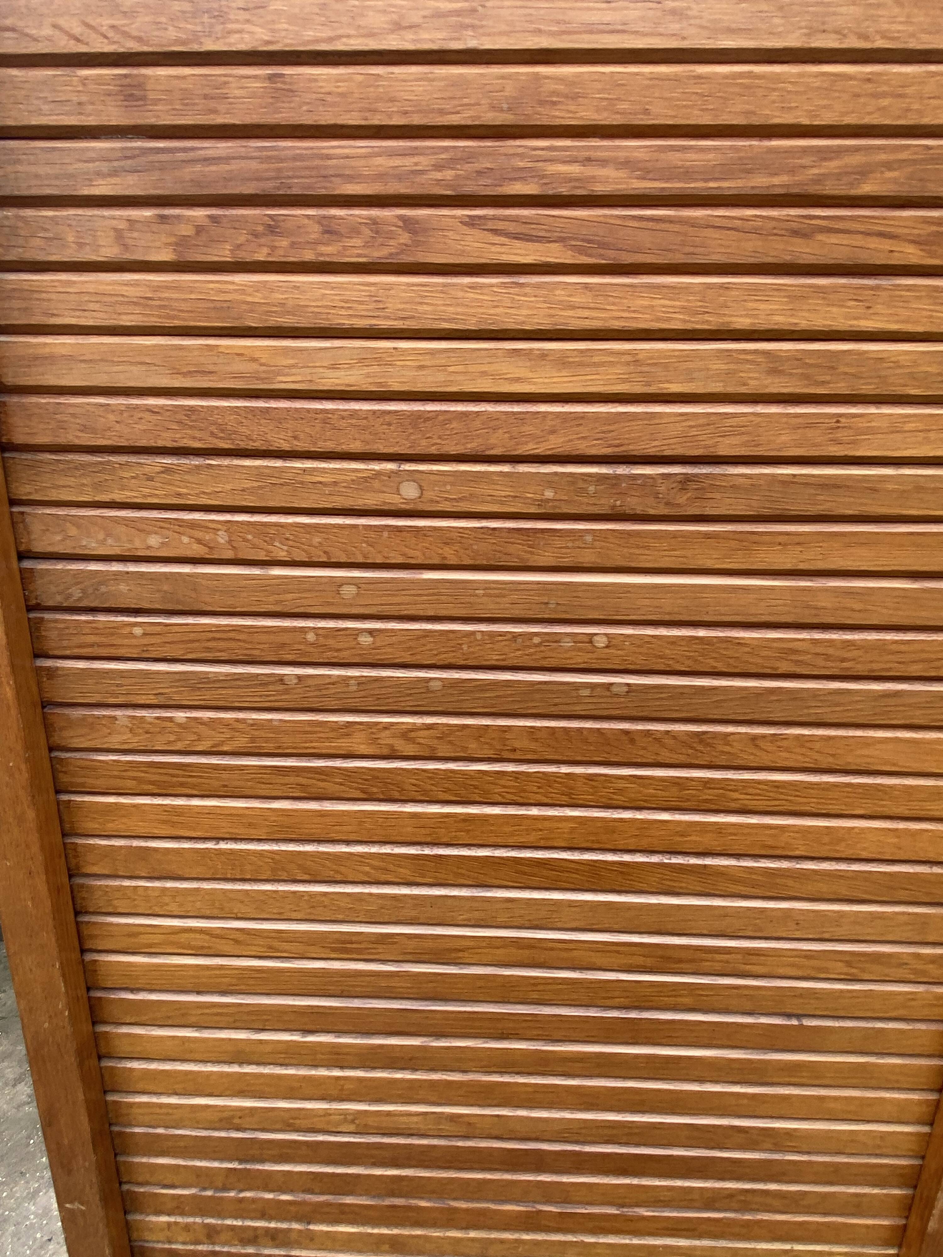 Double-column oak filing cabinet with curtains, 1950s.