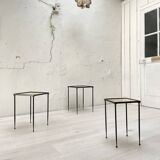 Suite of metal and glass nesting tables.