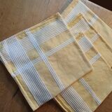 4 old yellow towels