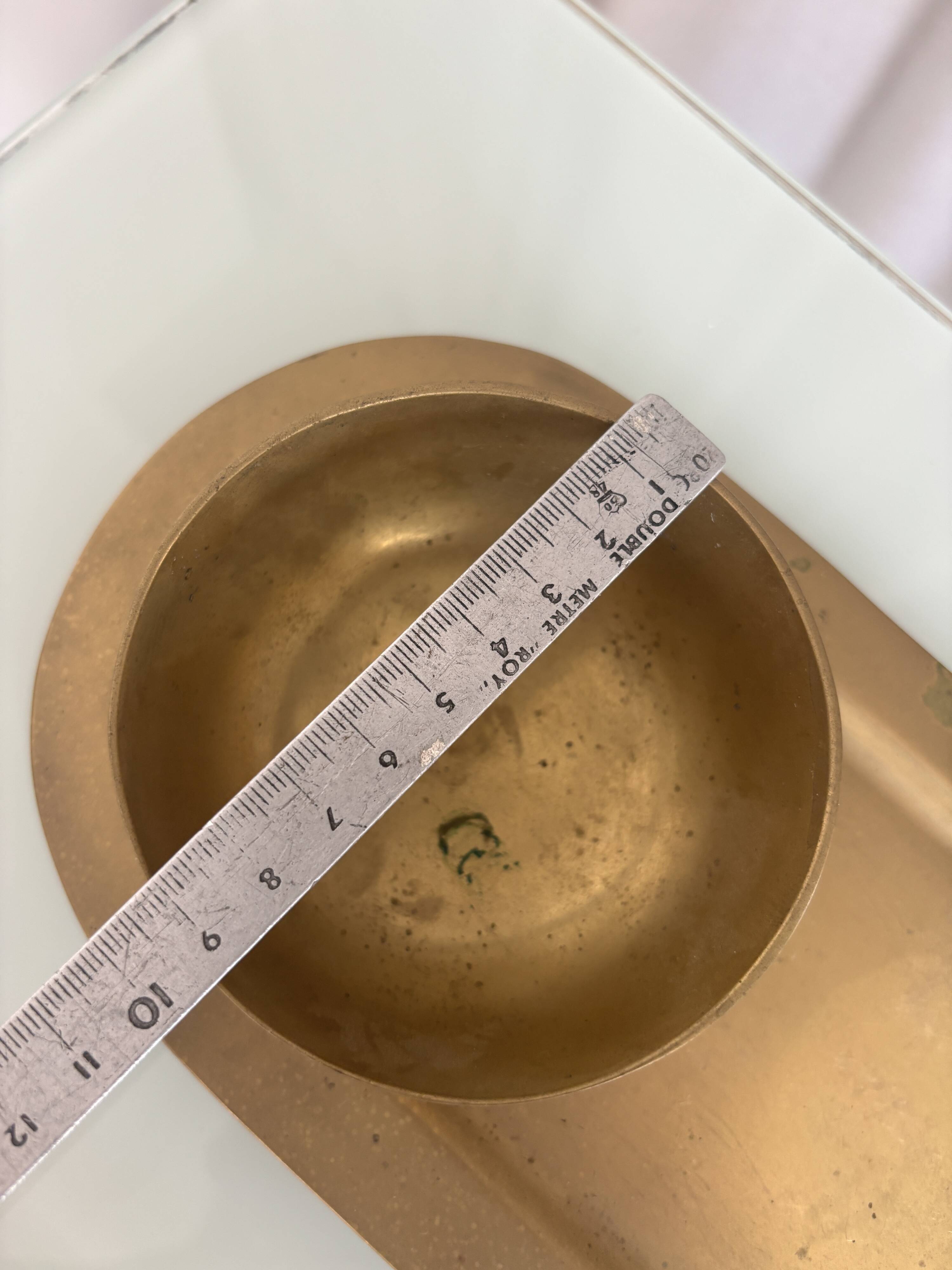 Empty pocket ensemble and bowl in solid brass signed Giò Lanciani.