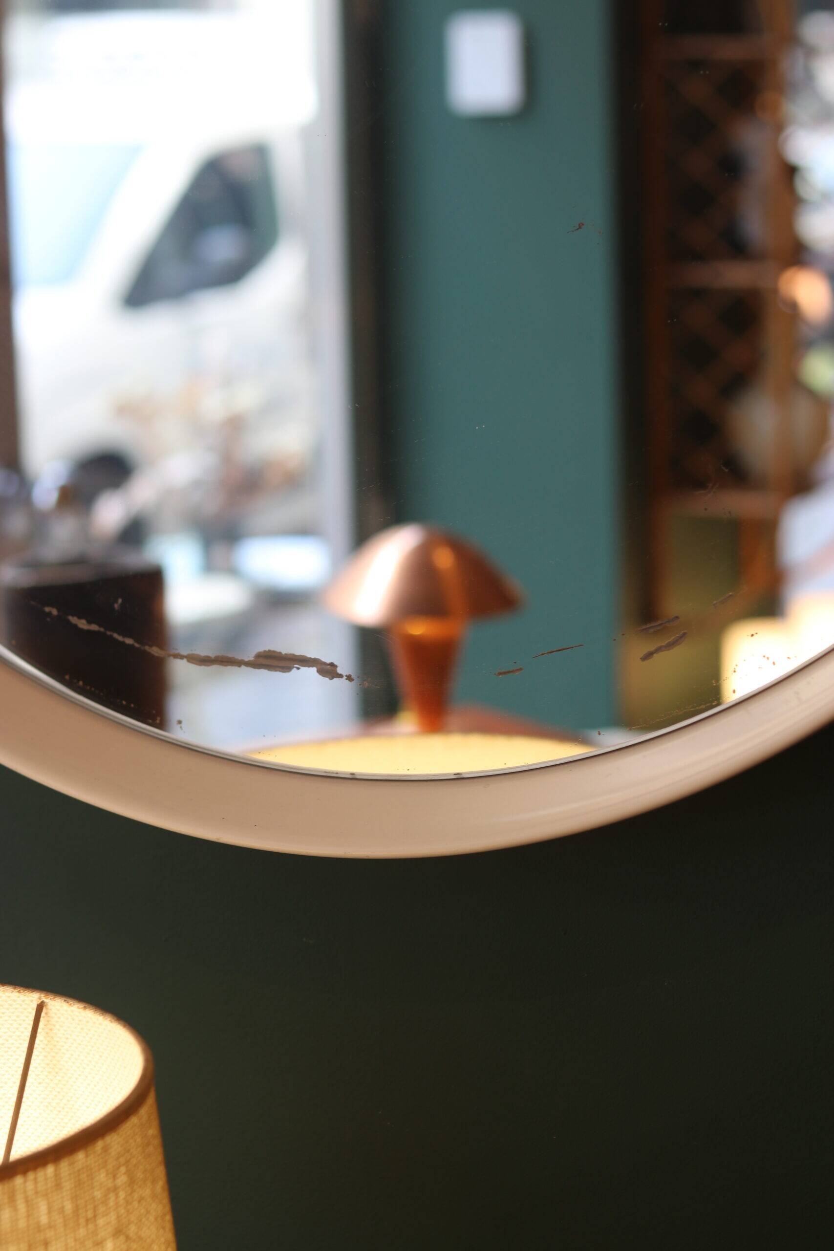 Large vintage circular mirror, plastic frame.