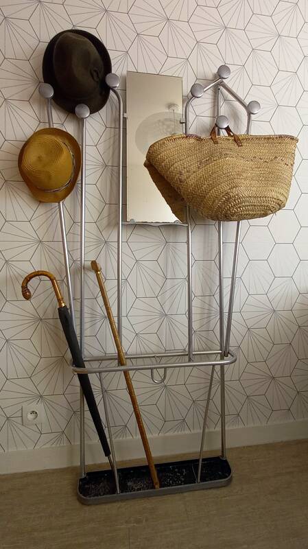 Vintage aluminum wall coat rack.