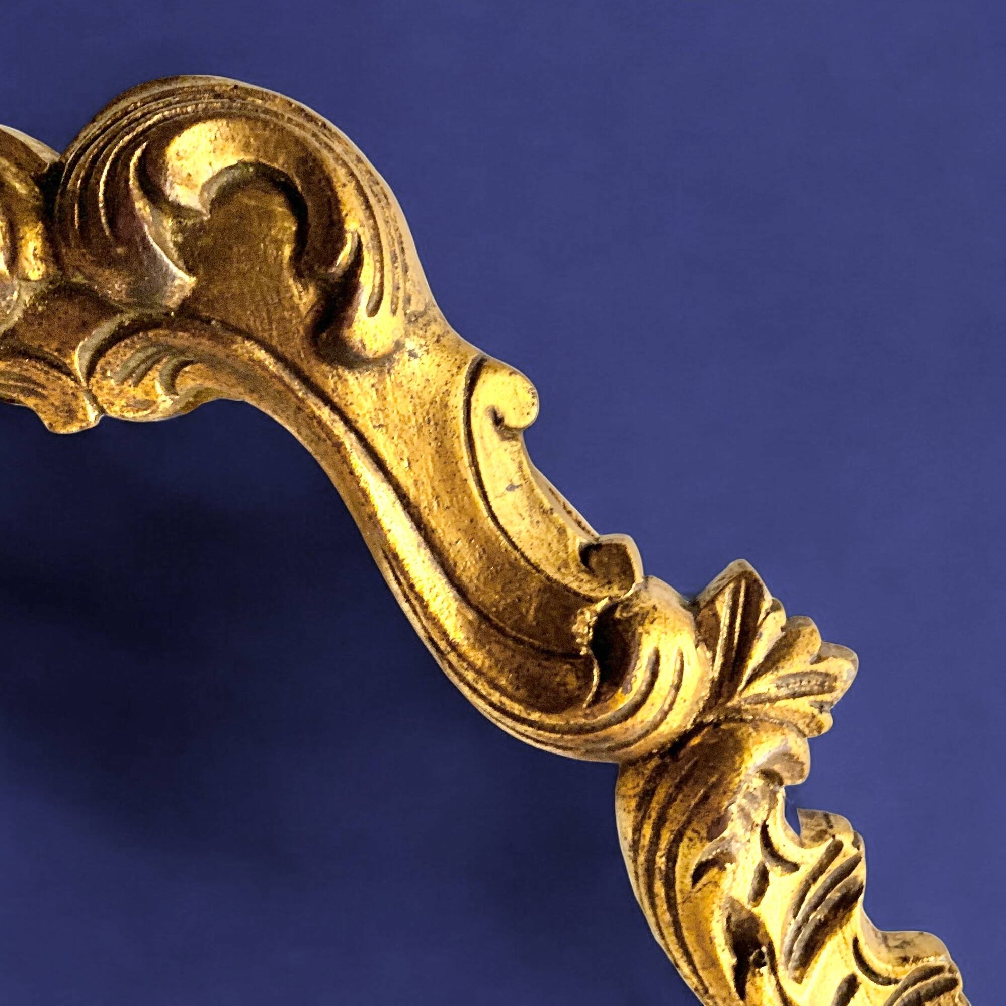 Rococo wall mirror in golden resin
