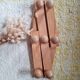 Wall-mounted accordion coat rack in solid pine