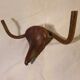 Brutalist bull head sculpture