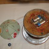 Old toy made of wood, aluminum and fabrics, animated and musical merry-go-round