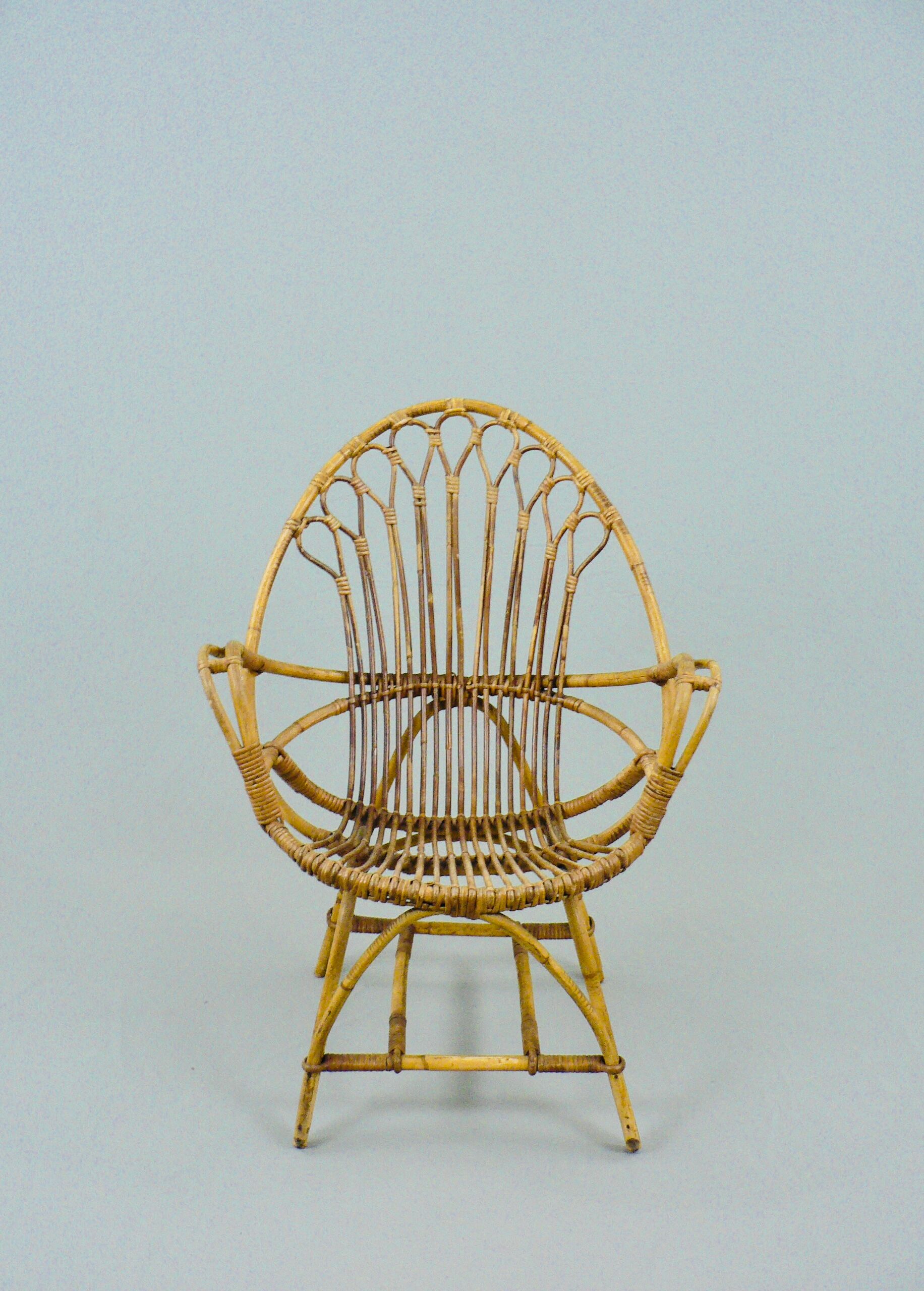 A pair of rattan chairs