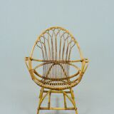 A pair of rattan chairs