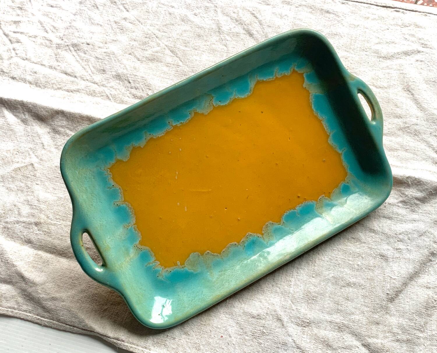 CAB turquoise and ochre ceramic dish with handles