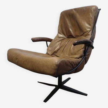 Industrial swivel armchair in cognac leather