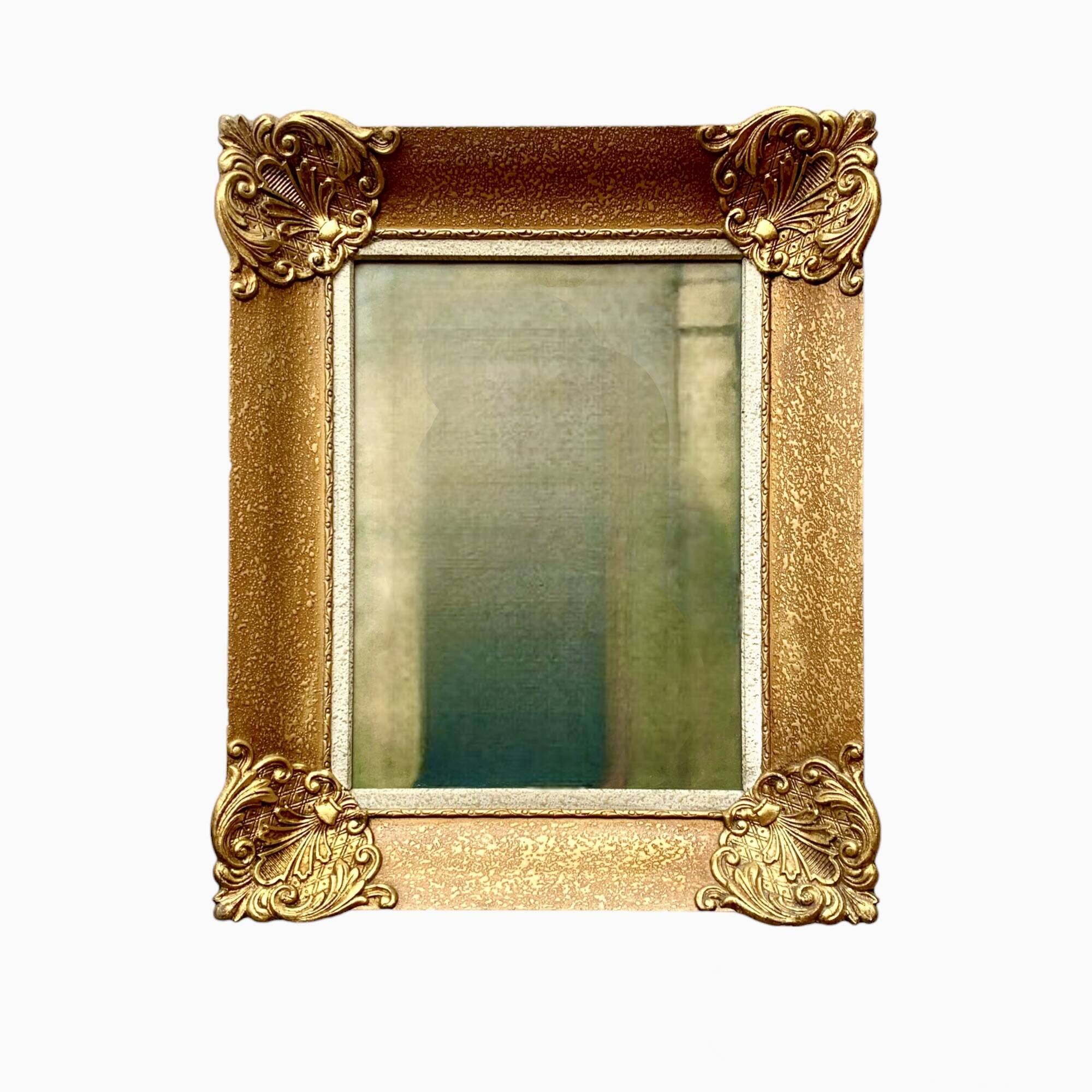 Old wall frame in carved gilded wood