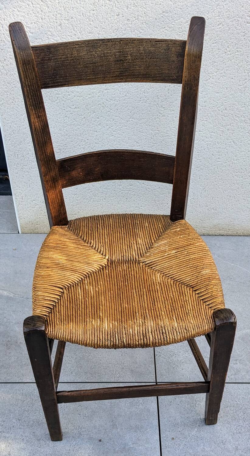 4 mismatched wood and straw chairs