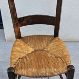 4 mismatched wood and straw chairs