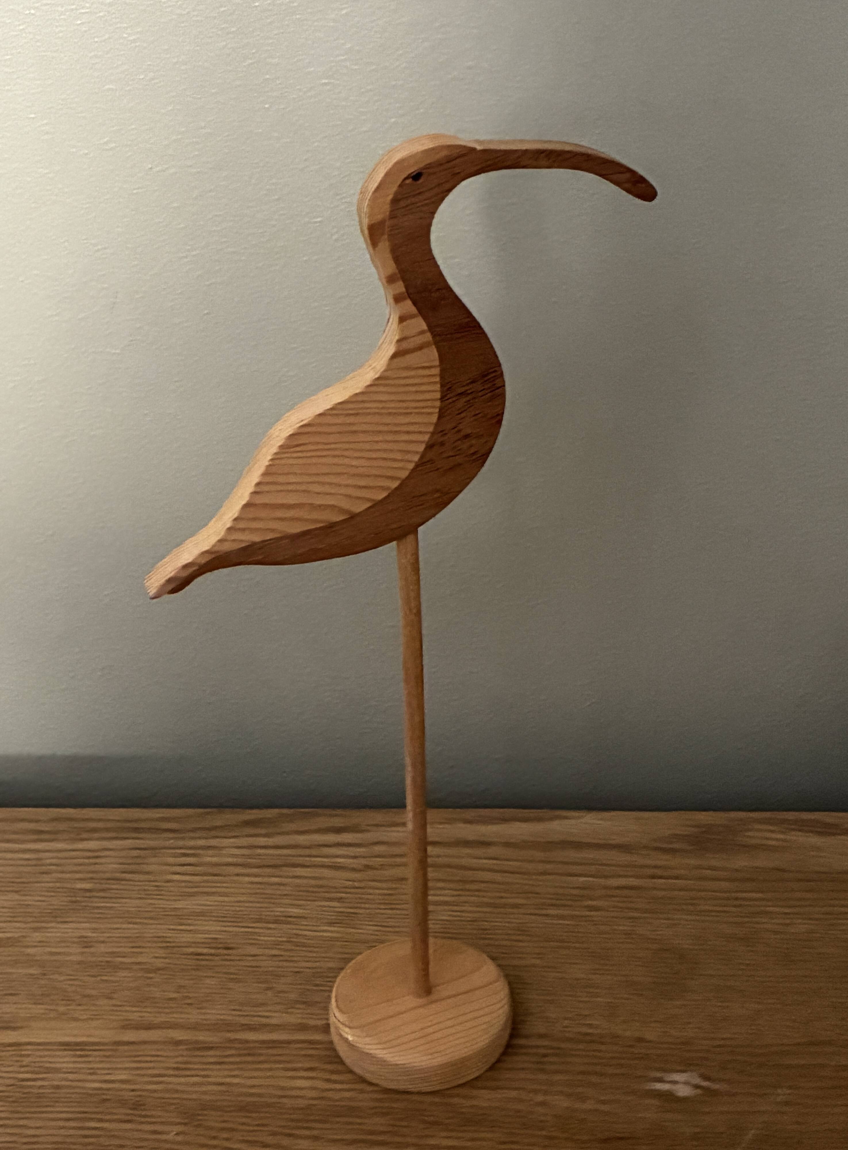 Wooden wading bird on a base