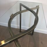 Console en acier brossé et laiton et plateau formé d'une dalle de verre. Travail français. Vers 1970