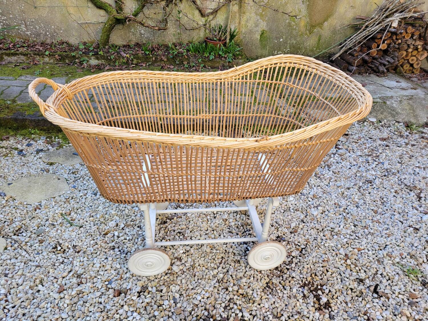 Wicker cradle on wheels, late 19th century