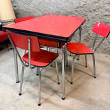 4 red Formica chairs with a 1970s table