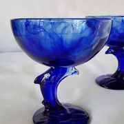 Set of 2 dolphin dessert cups in blue glass.