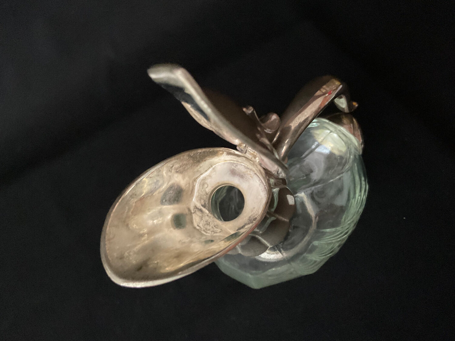 Glass decanter and silver metal duck