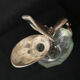 Glass decanter and silver metal duck