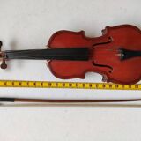 violin and decorative archer in antique varnished wood