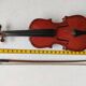 violin and decorative archer in antique varnished wood