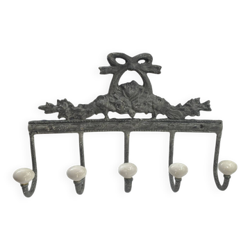 Patinated metal wall bracket and porcelain