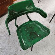 Vintage swivel workshop chair in green pressed sheet metal with a folding backrest.