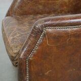 Grained cowhide armchair with a timeless design